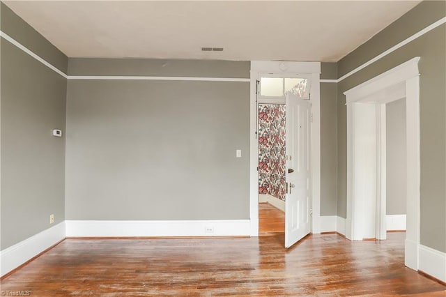 1025 W End Blvd, Winston-Salem, NC 27101 - spare room featuring wood finished floors, visible vents, and baseboards