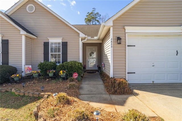 view of exterior entry featuring a garage