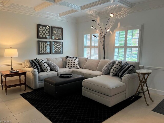 living room with tile patterned floors, coffered ceiling, and crown molding