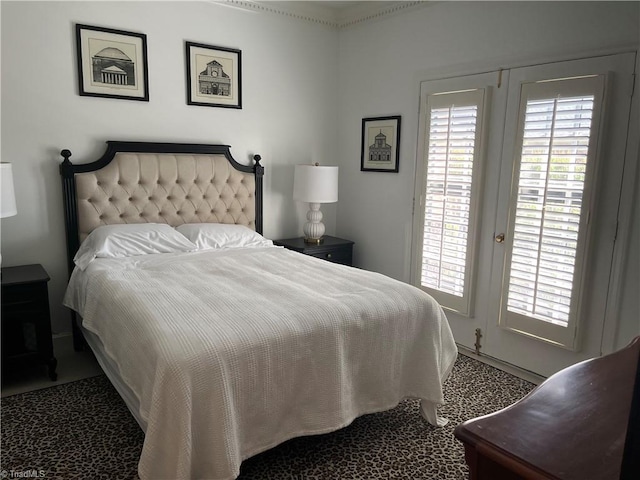 bedroom featuring multiple windows and carpet floors