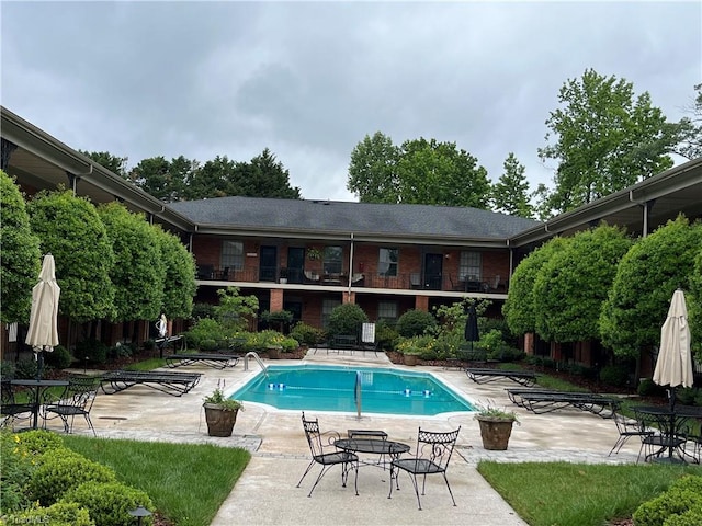 view of pool featuring a patio