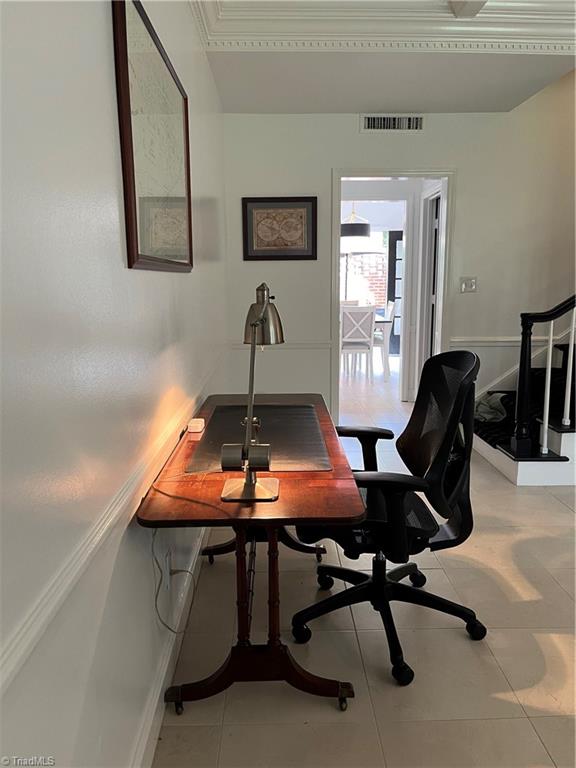 home office with tile patterned flooring