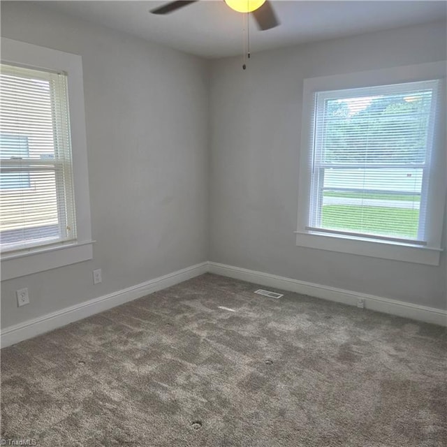 112 Kime St, Burlington, NC 27215 - unfurnished room featuring plenty of natural light, ceiling fan, carpet, and baseboards
