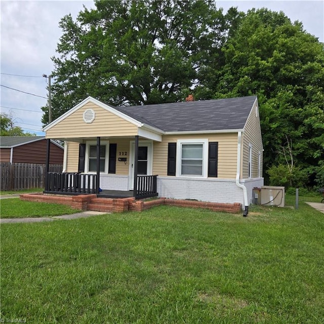 112 Kime St, Burlington, NC 27215 - view of front facade featuring a porch, brick siding, and a shingled roof