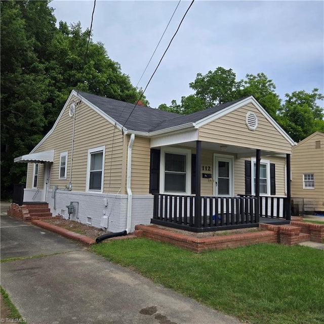 112 Kime St, Burlington, NC 27215 - bungalow-style house with a porch, brick siding, and asphalt driveway