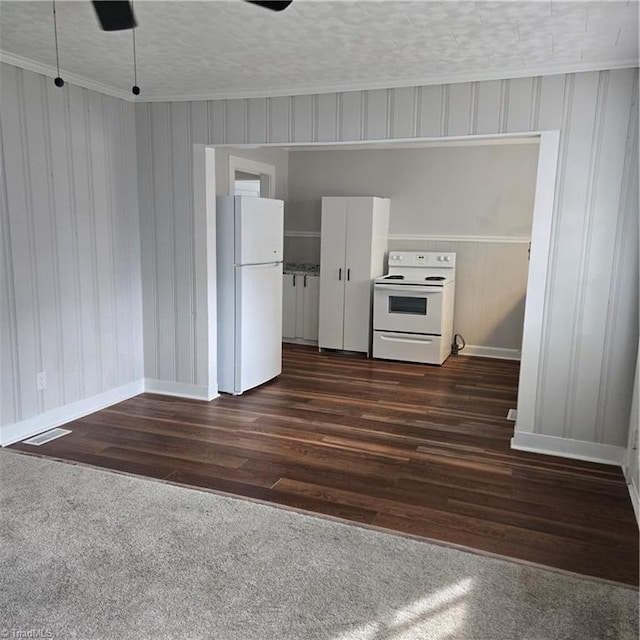 112 Kime St, Burlington, NC 27215 - kitchen featuring white appliances, baseboards, dark wood finished floors, crown molding, and dark colored carpet