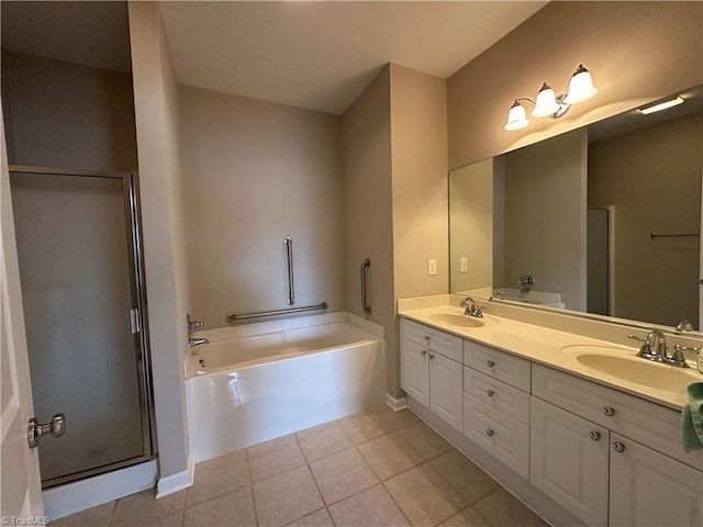 bathroom featuring tile patterned flooring, a garden tub, a sink, and double vanity