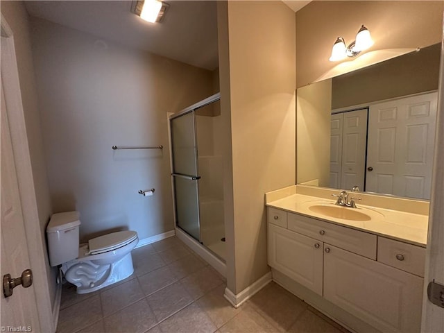 full bath with tile patterned flooring, toilet, baseboards, a closet, and a shower stall