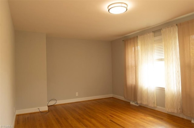 unfurnished room featuring wood-type flooring