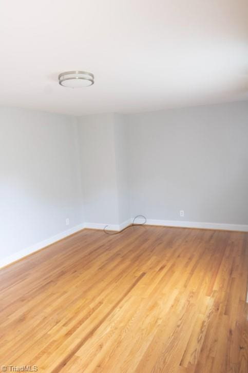 unfurnished room featuring light hardwood / wood-style floors