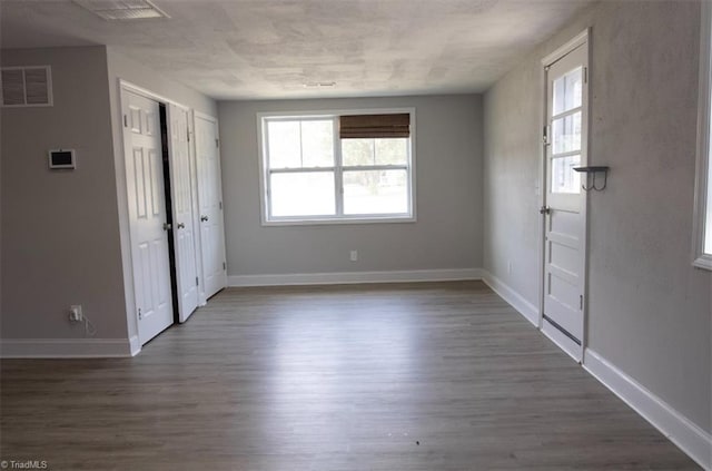 foyer featuring dark hardwood / wood-style floors