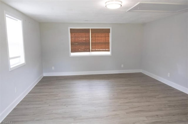 spare room featuring hardwood / wood-style floors