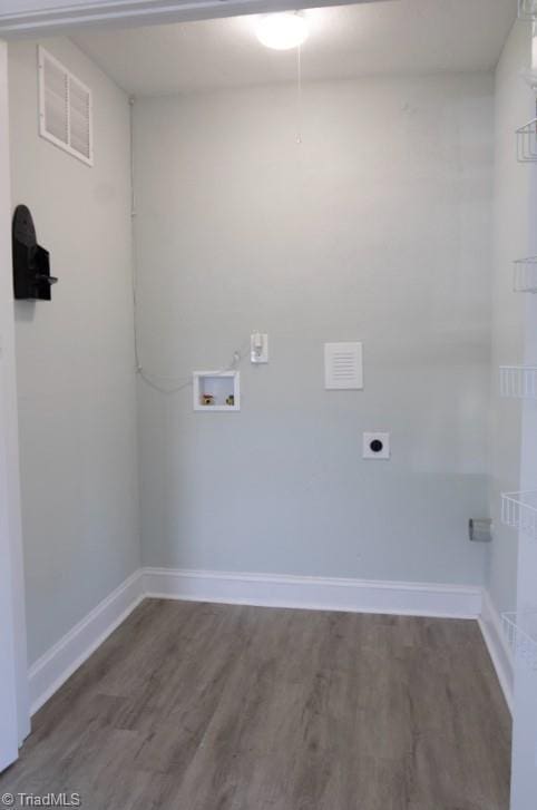 laundry room featuring washer hookup, hookup for an electric dryer, and dark wood-type flooring