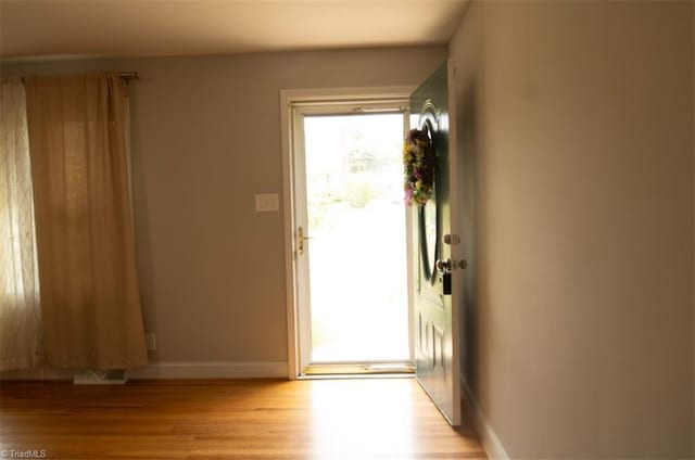 doorway with light hardwood / wood-style floors