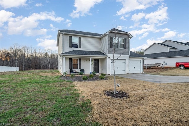 front of property featuring a front lawn and a garage