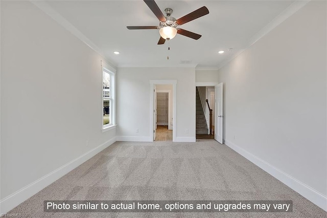 unfurnished bedroom featuring carpet floors, crown molding, baseboards, and recessed lighting