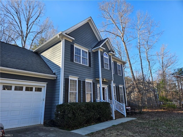 view of side of home featuring a garage