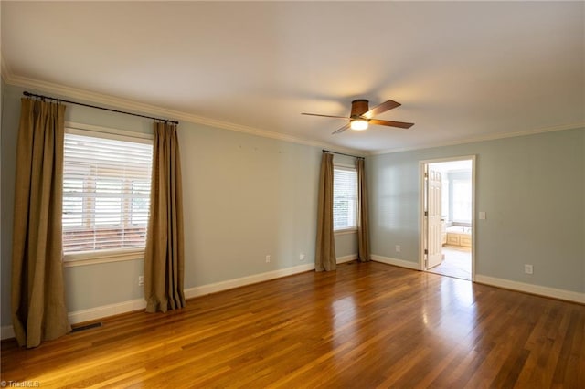 unfurnished room with ceiling fan, hardwood / wood-style flooring, and ornamental molding