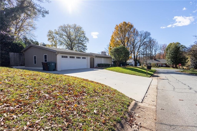 ranch-style house with a front lawn and a garage