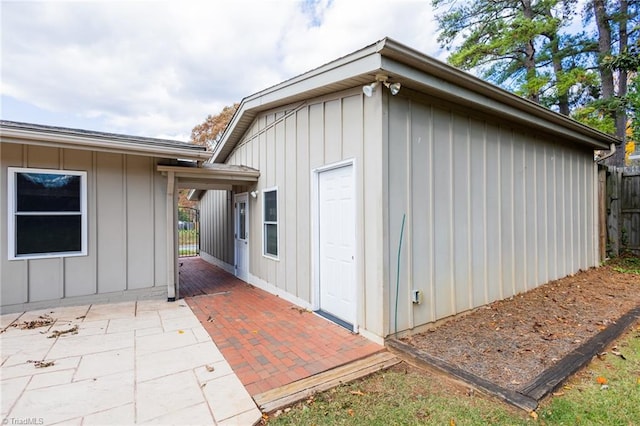 view of side of home featuring a patio