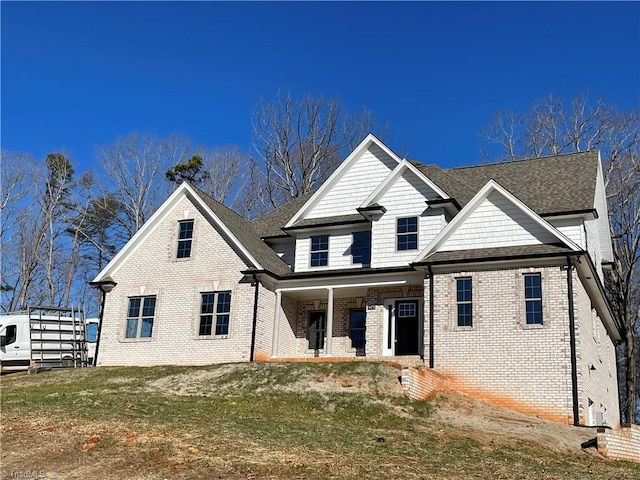 view of front of home with brick siding