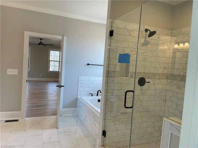 full bath featuring marble finish floor, a garden tub, crown molding, a shower stall, and baseboards