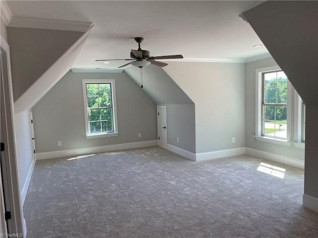 bonus room with vaulted ceiling, carpet, a ceiling fan, and baseboards