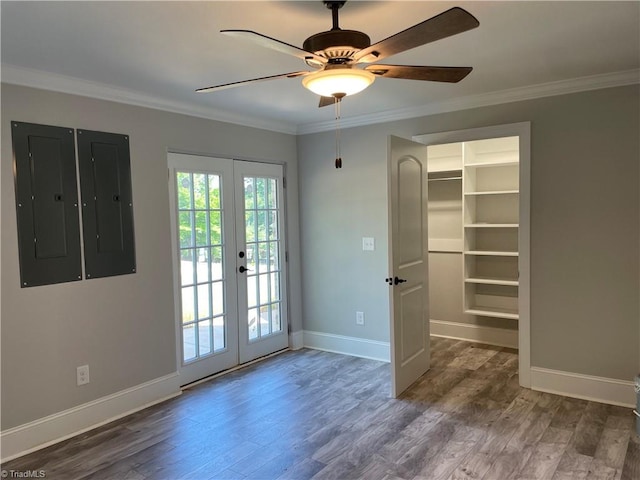 doorway with french doors, ornamental molding, and wood finished floors