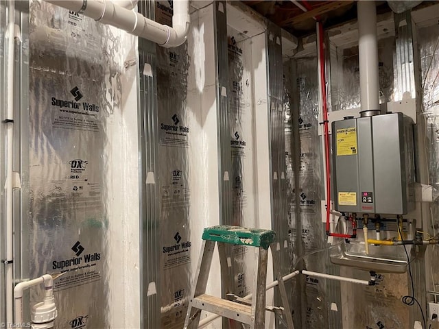 utility room with tankless water heater