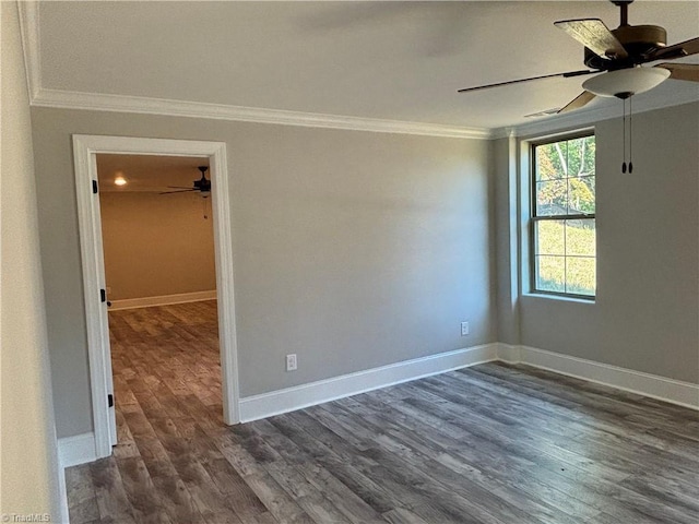 unfurnished room featuring dark wood-style floors, crown molding, baseboards, and a ceiling fan