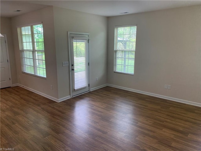 2015 Ram Rd, Greensboro, NC 27405 - doorway with healthy amount of natural light and dark wood-style floors