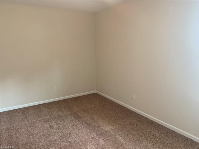 2015 Ram Rd, Greensboro, NC 27405 - unfurnished room with carpet flooring and baseboards