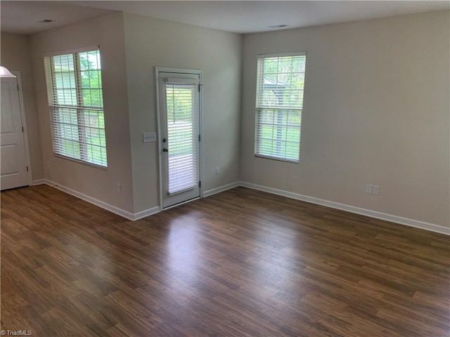 2015 Ram Rd, Greensboro, NC 27405 - doorway featuring healthy amount of natural light and dark wood-type flooring