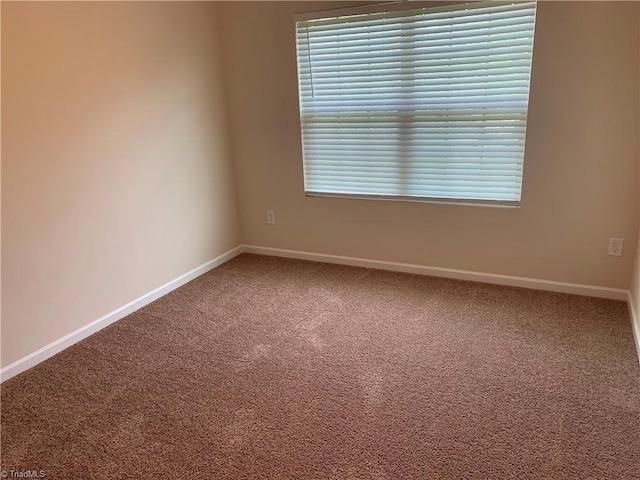 2015 Ram Rd, Greensboro, NC 27405 - spare room with carpet floors and baseboards