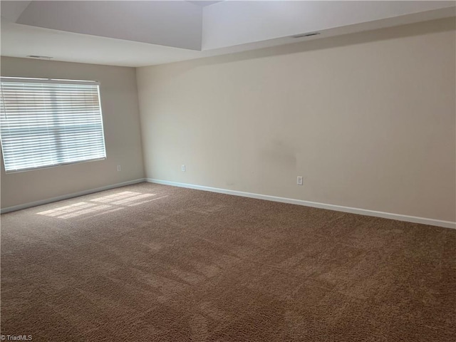 2015 Ram Rd, Greensboro, NC 27405 - unfurnished room featuring carpet floors and baseboards