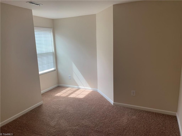 2015 Ram Rd, Greensboro, NC 27405 - unfurnished room featuring carpet flooring and baseboards