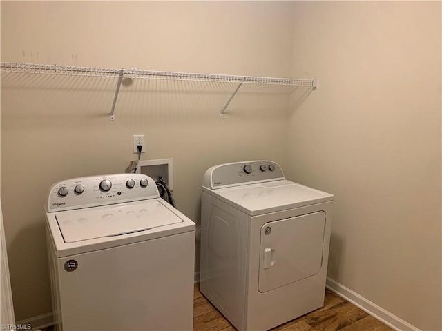 2015 Ram Rd, Greensboro, NC 27405 - laundry area featuring washer and clothes dryer and light wood-type flooring