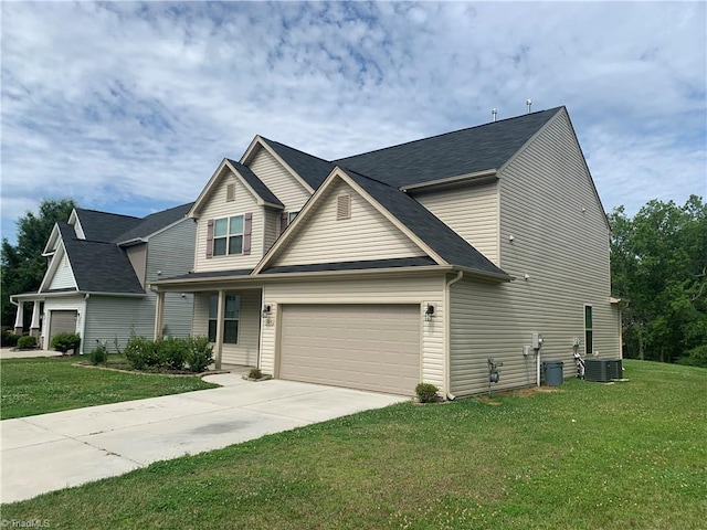 2015 Ram Rd, Greensboro, NC 27405 - traditional-style home with a garage, concrete driveway, and a front yard