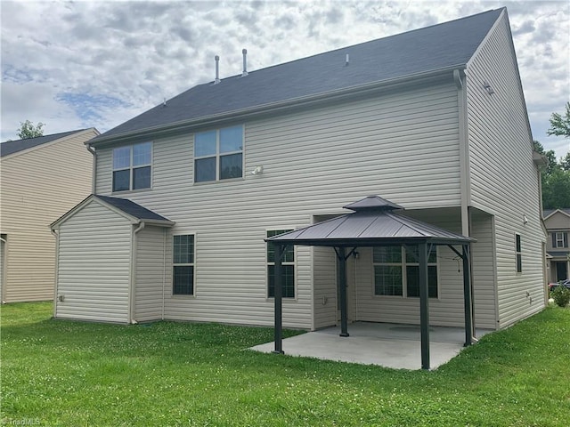2015 Ram Rd, Greensboro, NC 27405 - back of property featuring a gazebo, a patio, and a lawn