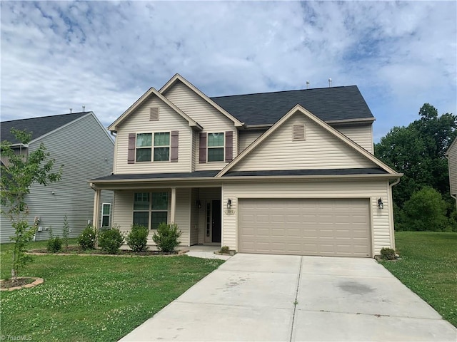 2015 Ram Rd, Greensboro, NC 27405 - view of front of home featuring driveway, a front lawn, covered porch, and an attached garage