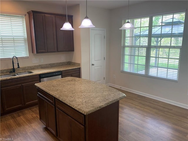 2015 Ram Rd, Greensboro, NC 27405 - kitchen featuring dishwasher, dark wood-style floors, a center island, and pendant lighting