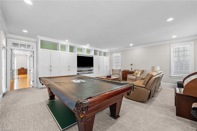 recreation room with pool table, ornamental molding, and light colored carpet