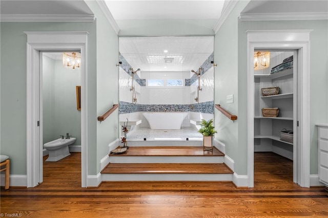 stairway with hardwood / wood-style flooring and crown molding