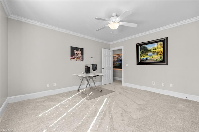 interior space featuring ornamental molding, light colored carpet, and ceiling fan