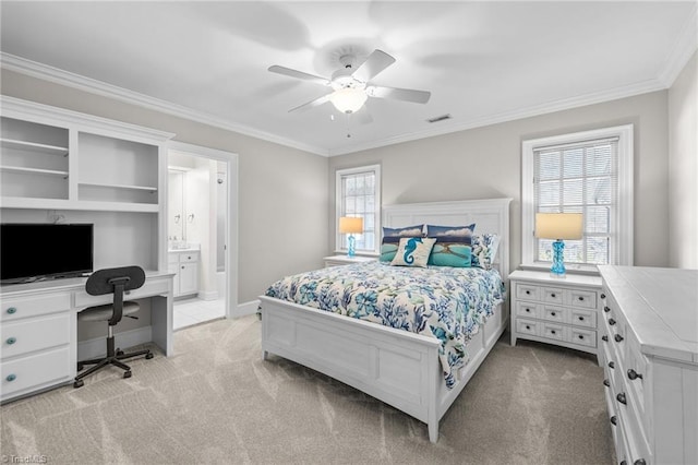 carpeted bedroom featuring crown molding, ceiling fan, and ensuite bath