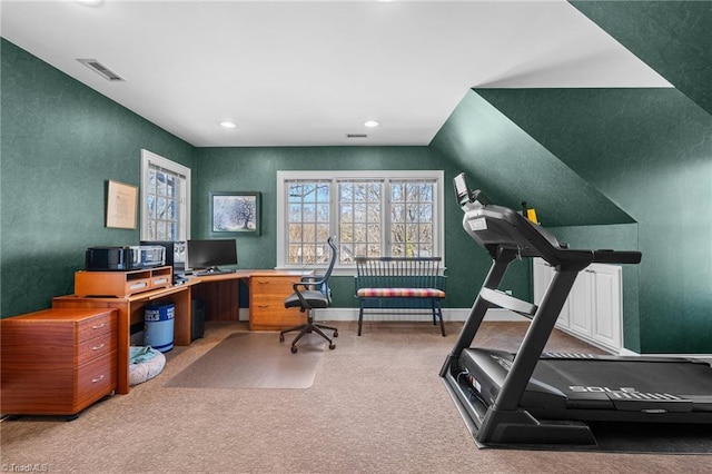 carpeted office featuring vaulted ceiling