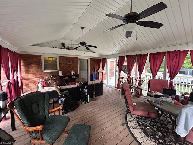 wooden terrace with an outdoor living space and ceiling fan