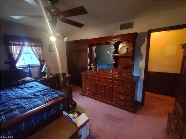 bedroom with light colored carpet and ceiling fan