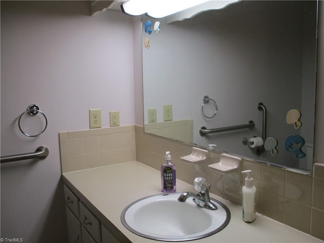 bathroom featuring vanity and tasteful backsplash