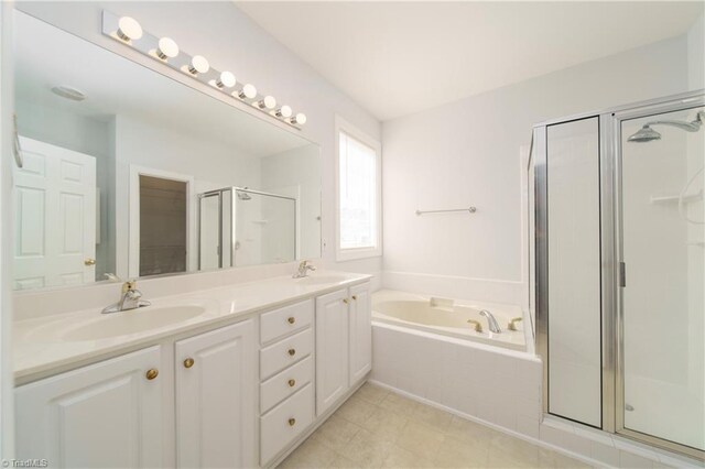 bathroom with separate shower and tub and vanity